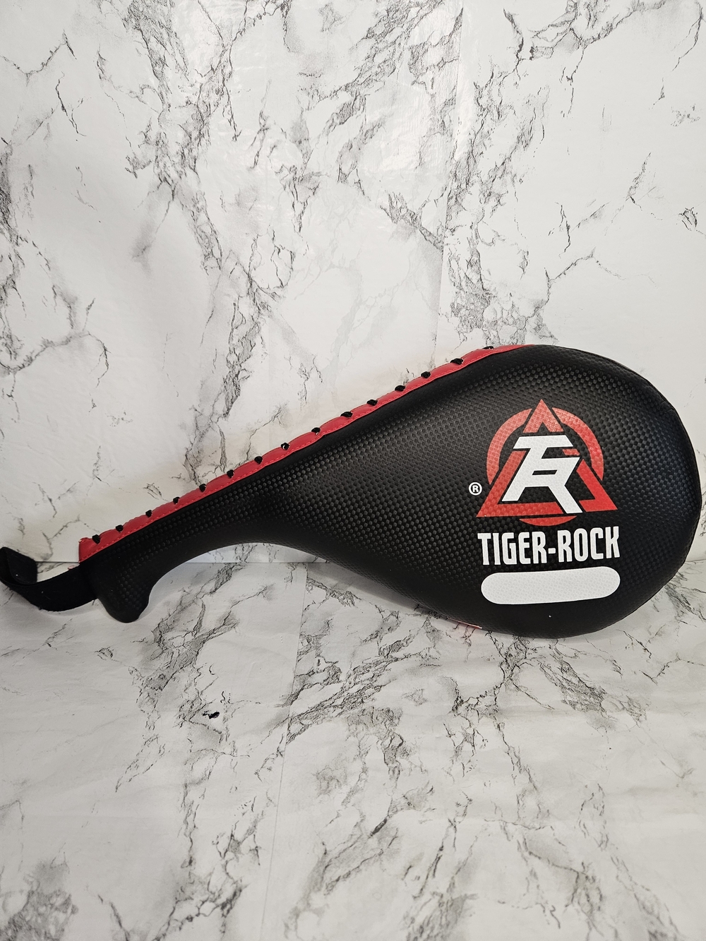Tiger-Rock martial arts double-sided kicking target paddle.